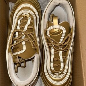 Gold and White Nike Sneakers